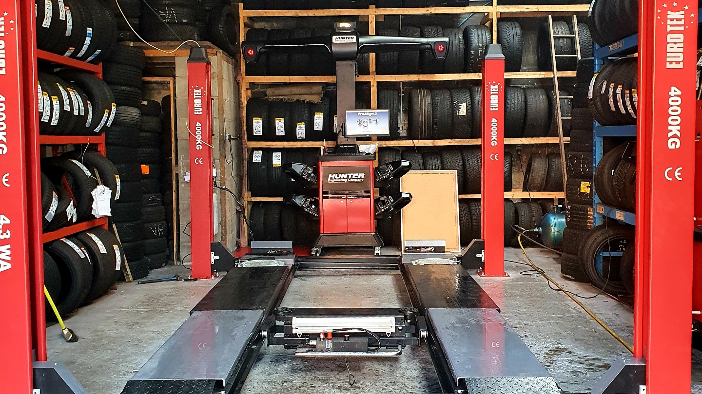 Fast Fit Tyres workshop interior with tyres in stock